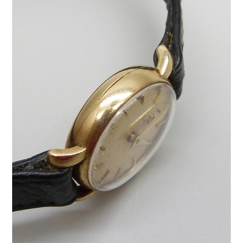 970 - A lady's 9ct cased Omega wristwatch on an Omega strap, (replacement crown, not Omega)