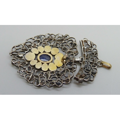 979 - A Georgian white and yellow metal pendant, set with rose cut diamonds and a Ceylon cabochon sapphire... 