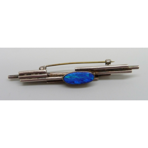 984 - A Modernist white metal and opal set bar brooch, 7cm