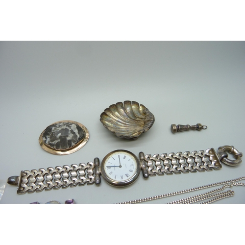 986 - A silver wristwatch, silver shell salt, hallmarked silver Juju West African amulet, Birmingham 1926,... 