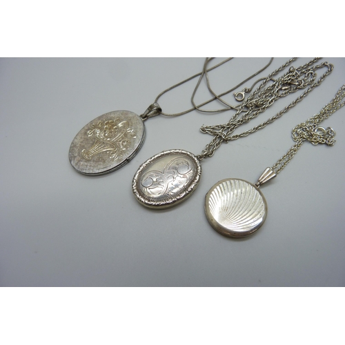 990 - Three silver lockets and chains