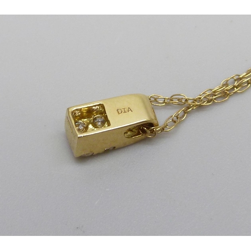 991 - An 18ct gold and diamond pendant on a fine 9ct gold chain, total weight 1.6g