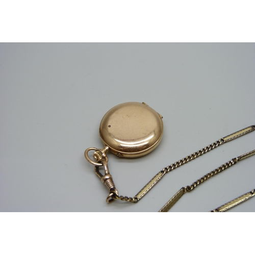 992 - A 14ct gold and enamel fob watch set with one small diamond and with a fancy link chain, enamel a/f,... 