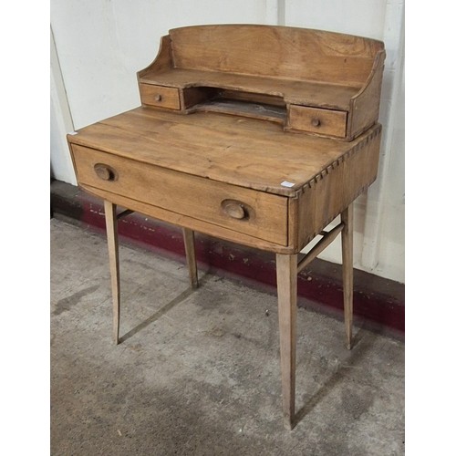 17 - An Ercol Blonde elm 439 model Windsor desk