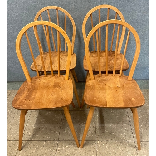 25 - A set of four Ercol Blonde elm and beech Windsor chairs