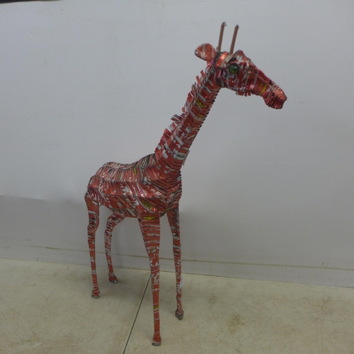 2064 - A decorative giraffe ornament made from shredded Coca Cola cans