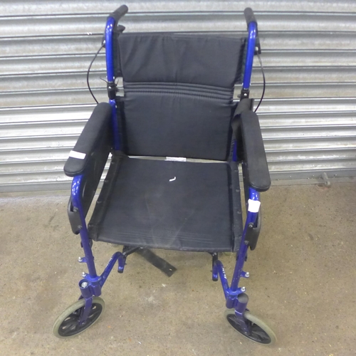 2080 - A Invacare small wheel operator driven folding wheelchair