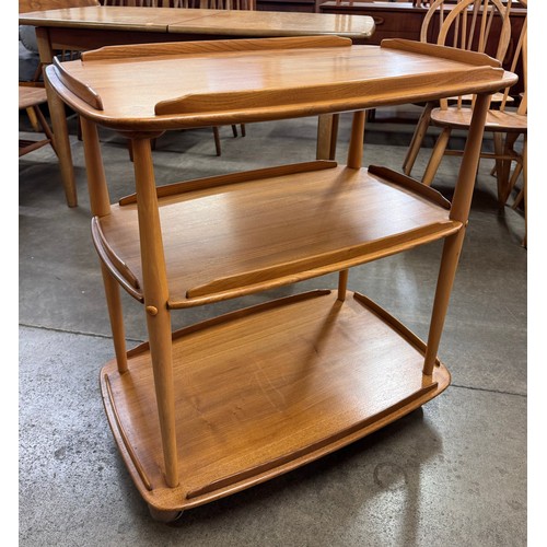 19 - An Ercol Blonde elm and beech Windsor trolley