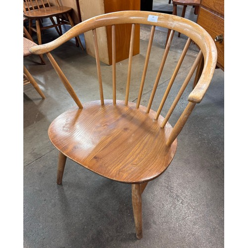 28 - An Ercol Blonde elm and beech 338 model cowhorn chair