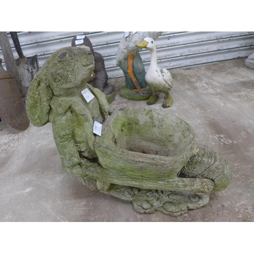 2160 - A stone effect concrete rabbit with a wheelbarrow planter