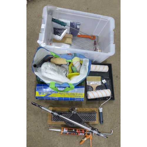 2012 - A large plastic box of decorating equipment, including rollers, paint brushes, tile cutter and an AG... 