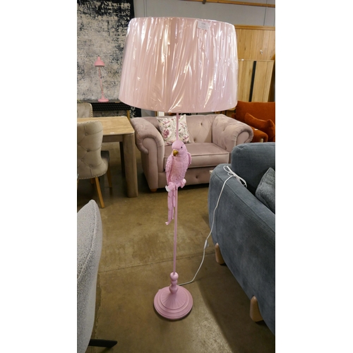 1336 - A pink floor standing parrot lamp