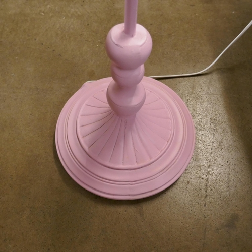 1336 - A pink floor standing parrot lamp