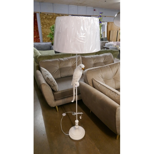 1341 - A white floor standing parrot lamp