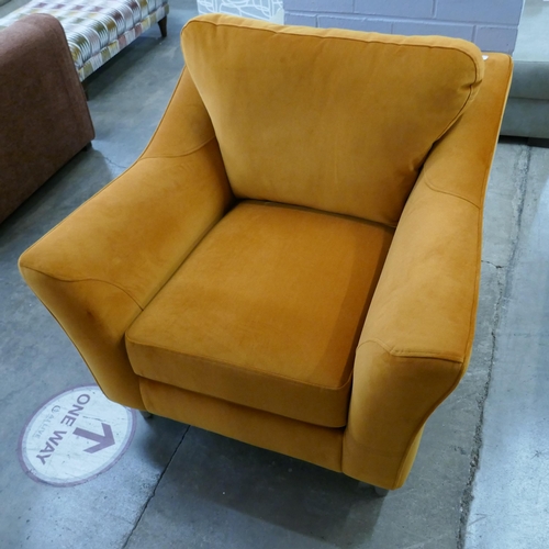 1441 - A tangerine velvet armchair - brand new