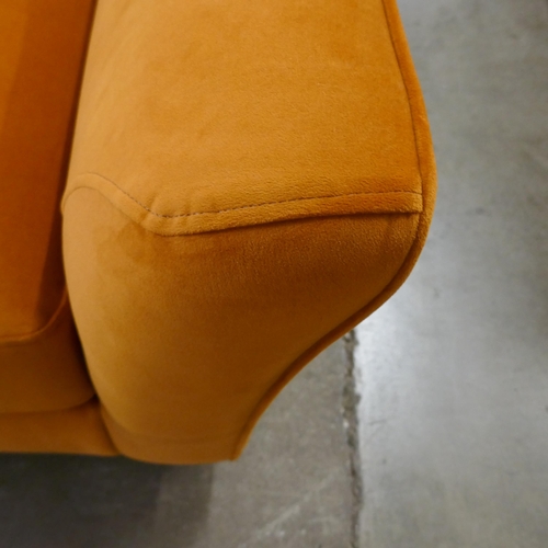 1441 - A tangerine velvet armchair - brand new