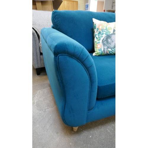 1453 - A turquoise velvet love seat - manufacturer's return