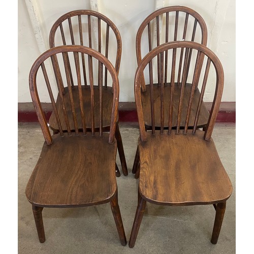 180 - A set of four elm Windsor kitchen chairs