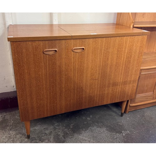 34 - A Singer 744 model teak sewing machine cabinet