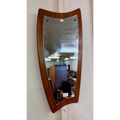 35 - A teak asymmetrical framed mirror