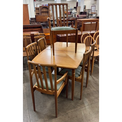 39 - A Meredew teak extending dining table and six chairs