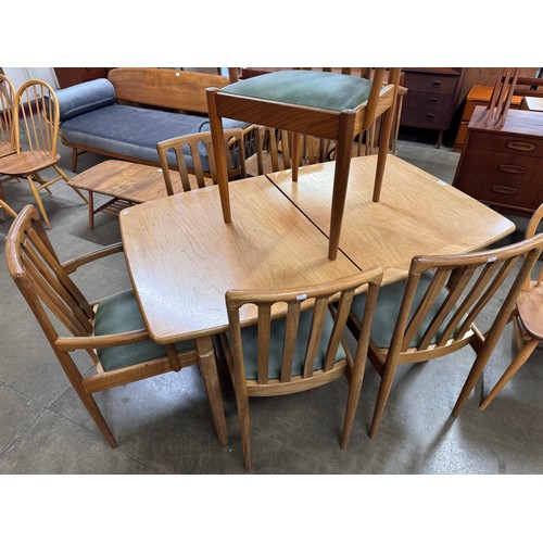 39 - A Meredew teak extending dining table and six chairs