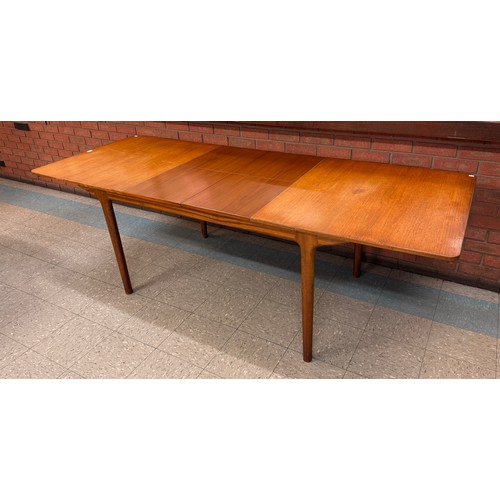 41 - A McIntosh T3 model teak extending dining table