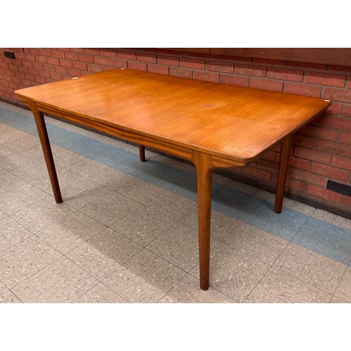 41 - A McIntosh T3 model teak extending dining table