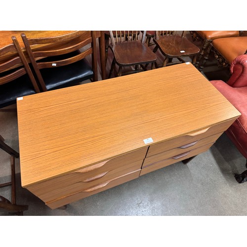 48 - A Europa teak chest of drawers