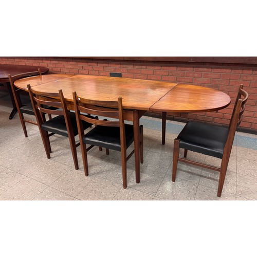 49 - A Danish teak extending dining table and four chairs