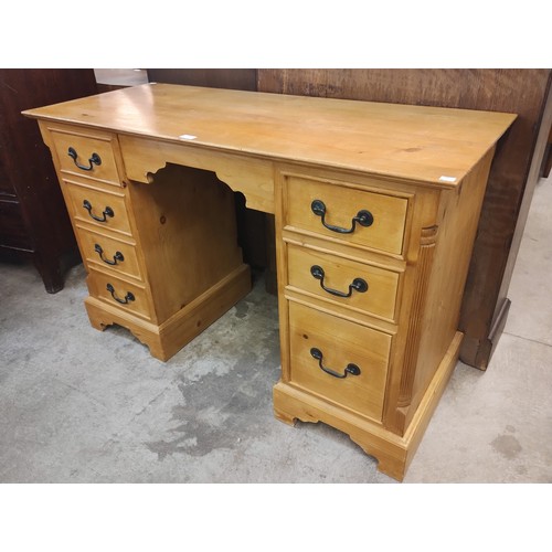 209 - A George III style pine kneehole desk