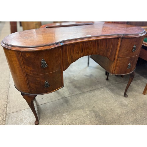 133 - A George I style walnut kidney shaped desk