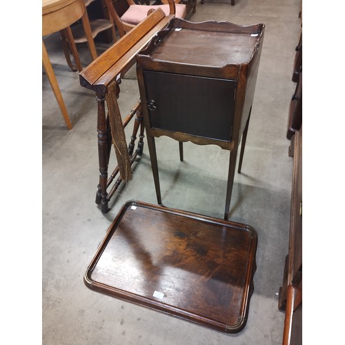 153 - An early 20th Century carved oak folding butlers tray and a George III mahogany pot cupboard