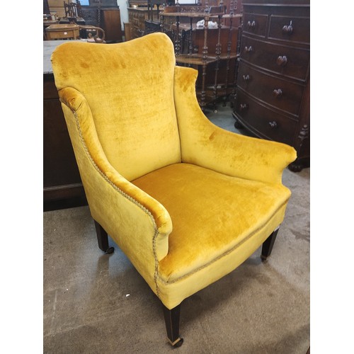 154 - An Edward VII mahogany fabric upholstered armchair