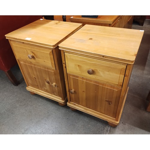 159 - A pair of pine bedside cupboards