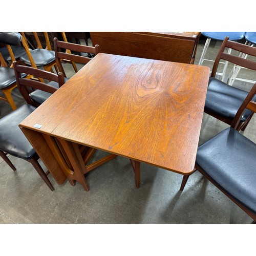 54 - A Jentique teak 507 model table and a set of four 38 model chairs