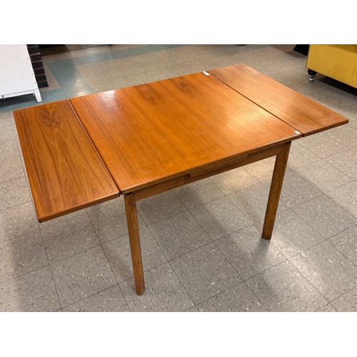 55 - A teak draw leaf table