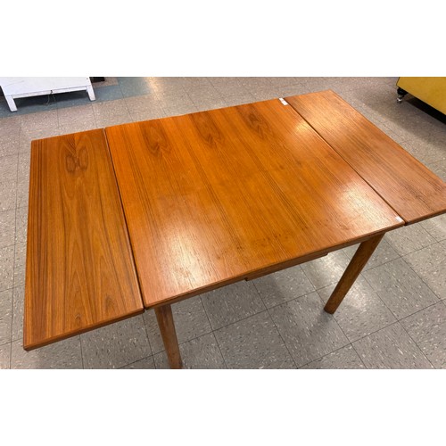 55 - A teak draw leaf table