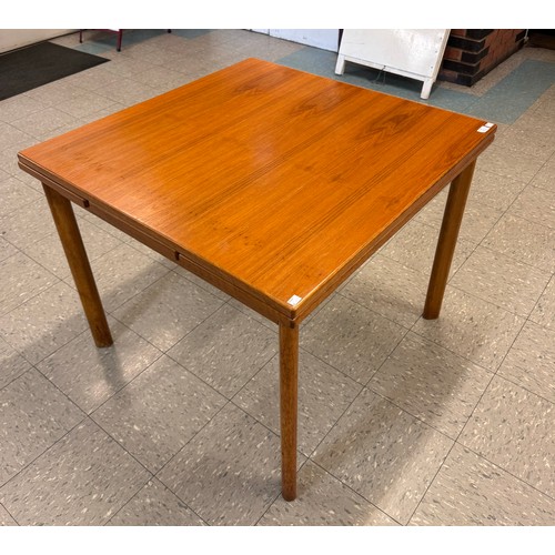 55 - A teak draw leaf table