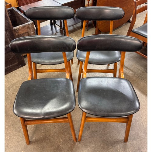 56 - A set of four teak and black vinyl chairs