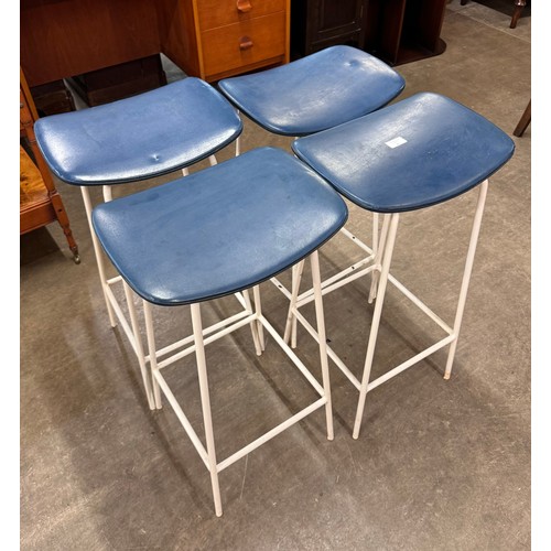 58 - A set of four Kandya white tubular metal and blue vinyl Program stools, designed by Frank Guille