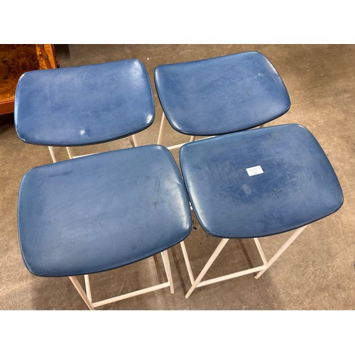 58 - A set of four Kandya white tubular metal and blue vinyl Program stools, designed by Frank Guille