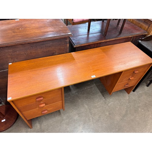 59 - A Stag Cantata teak desk, designed by John & Sylvia Reid