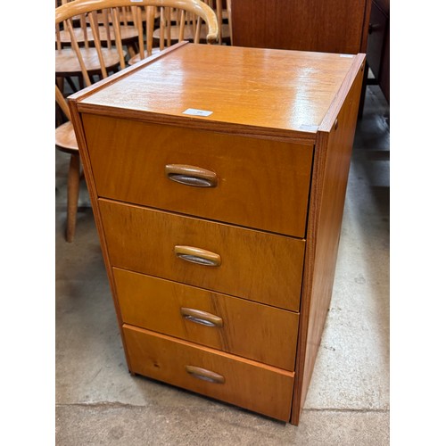 66 - A small teak chest of drawers