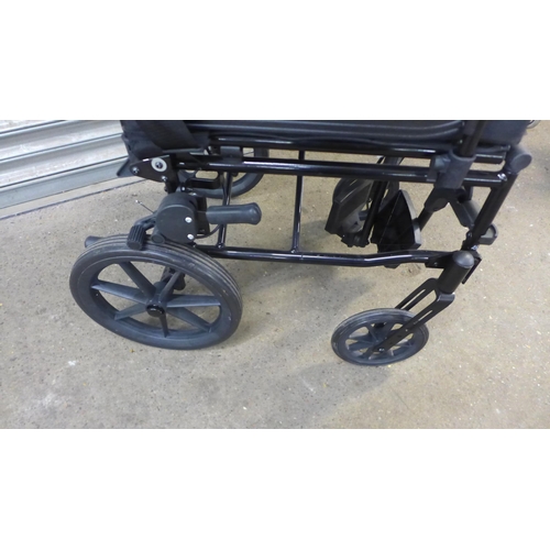 2138 - An R Healthcare small wheel operator driven wheelchair with footrests and a Days walking aid/rollato... 