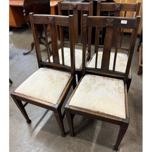 143 - A set of four Edward VII oak dining chairs