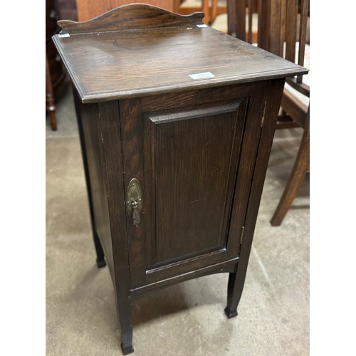 144 - An Arts and Crafts oak bedside cabinet