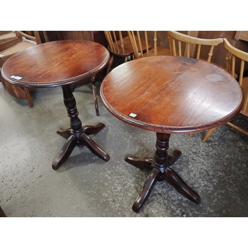 164 - A pair of elm circular pub tables