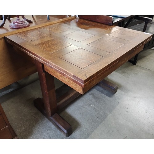 167 - An Art Deco oak draw leaf table