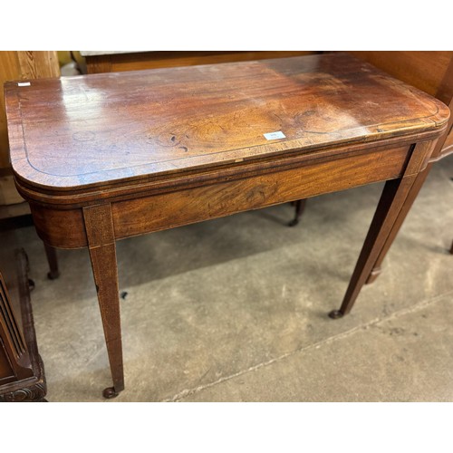 200 - A George IV mahogany foldover tea table